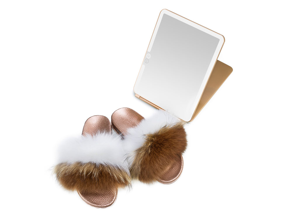 Overhead brown and white fur slippers photoshoot
