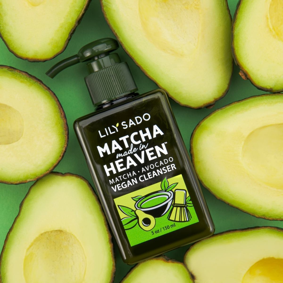 cleanser beauty product shot with avocado on green background