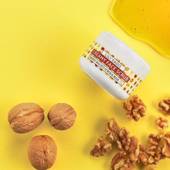 cosmetics product shot on yellow background with walnuts and honey