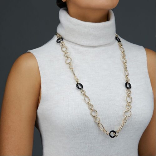 Long Necklace Photoshoot on a model on a grey background for eCommerce listing