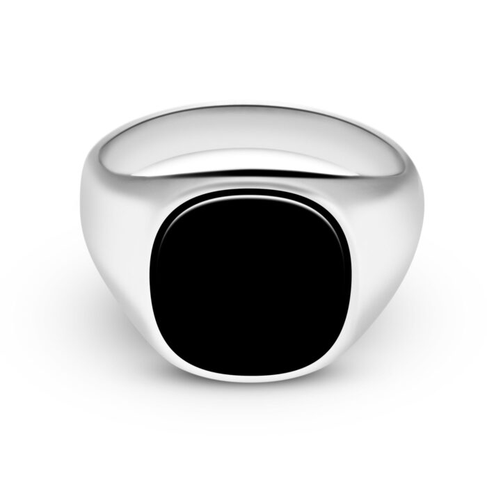 Front side shot of a male ring with a black gem for a jewelry photoshoot