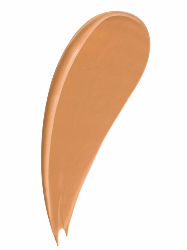 Cosmetic swatch of a brown colored beauty cream creatively styled on a white background.