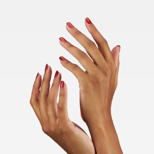 Professional commercial photoshoot with a female hand model on a white background