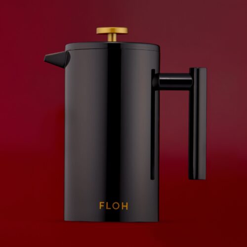 Black color teapot product photoshoot on a dark burgundy background by Isa Aydin NJ NY LA
