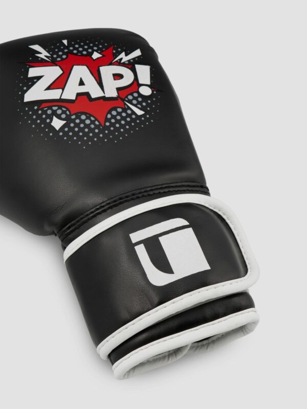 Product photography of a black and white leather boxing glove with white background