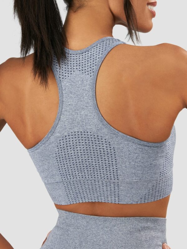Back shot of a female black model wearing grey tigear sport set
