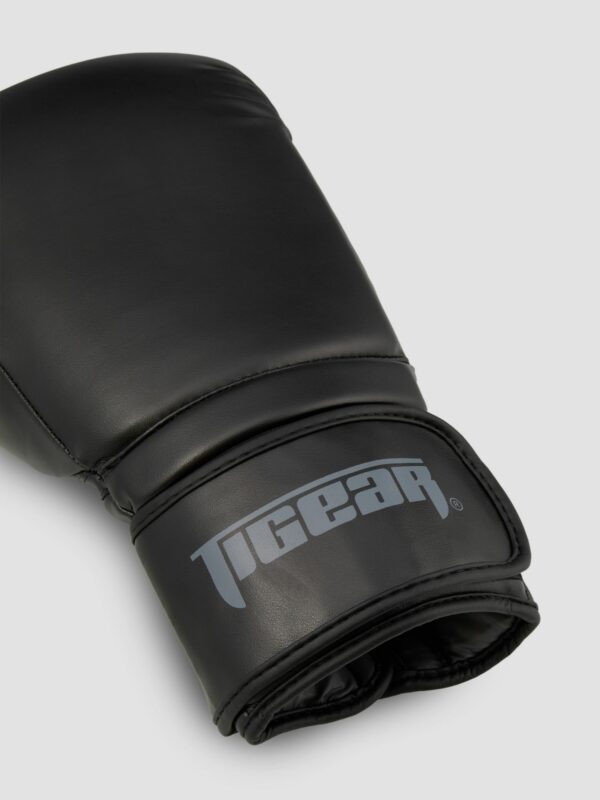Product photography of a black leather glove with white background