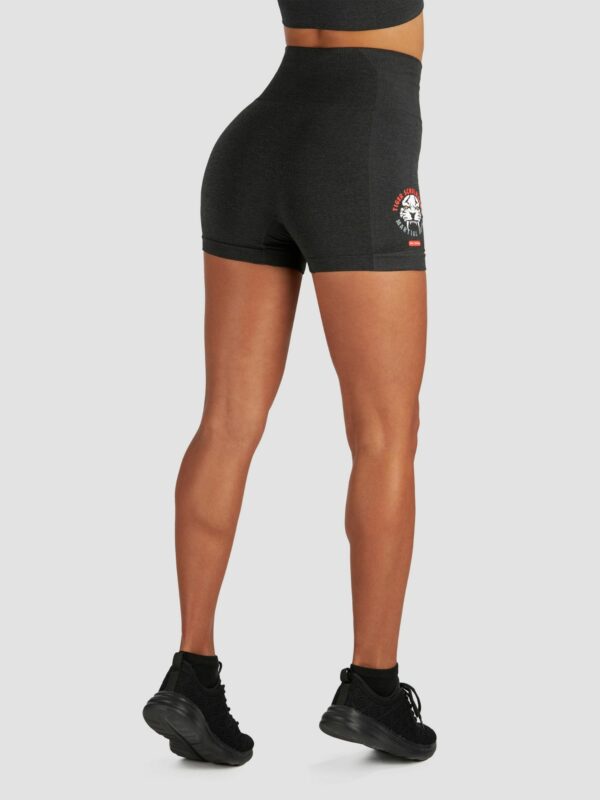 Apparel photography of tigear sport shorts with white background and model is wearing trainers too