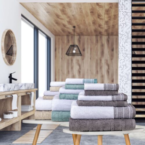 Creative lifestyle shot of multi colored towels product photography with wooden background