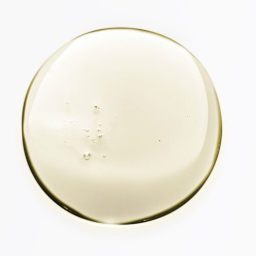Liquid swatch of a cosmetic product with bubbles in round shape.