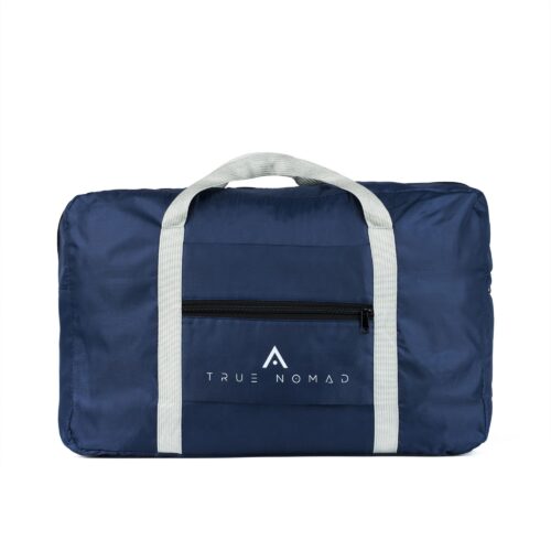 Blue colored travel back with light grey colored strips and handle shot on a white background by Isa Aydin nj ny la