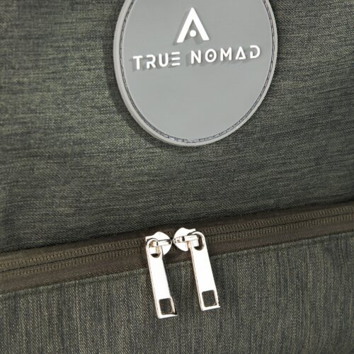 Close up hero shot of a travel bag showing the texture of the bag, quality of the zips and true nomad logo.