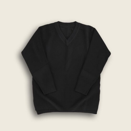 Flat lay clothing photography of a black V necked sweater