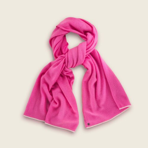 Lay flat photography of a pink colored scarf folded in a creative way