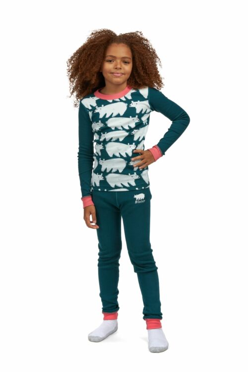 Child female black model with curly hairs posing for clothing photography on a white background.
