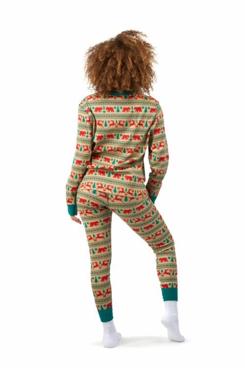 Back shot of a female model with curly hairs posing for clothing photography wearing pajama and shirt on a white background.