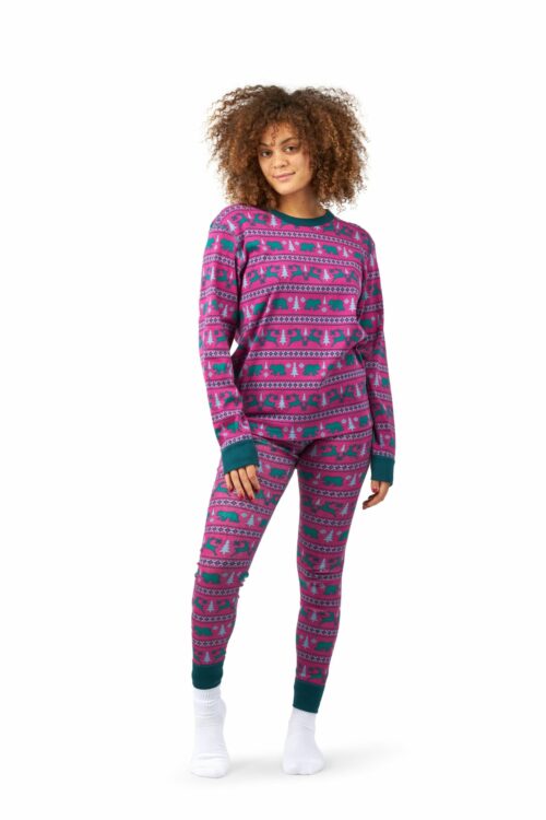 Female black model with curly hairs posing for clothing photography wearing animals printed pajama and shirt.