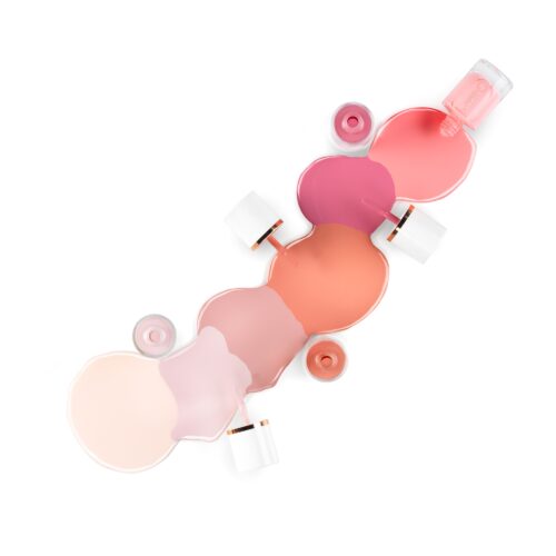 Creative cosmetics photography of 7 nail polish bottles with swatches set up according to each bottle by Isa Aydin nj ny la