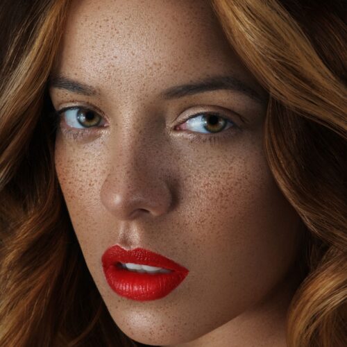 Model headshot with red lipstick on a female model