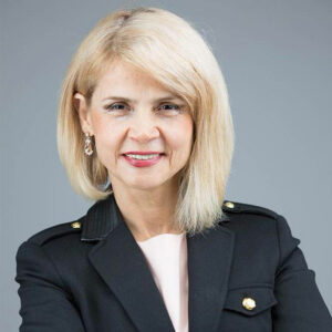 Female business headshot on gray background