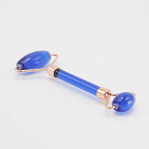 Blue face roller product photoshoot on a white background by Isa Aydin nj ny la