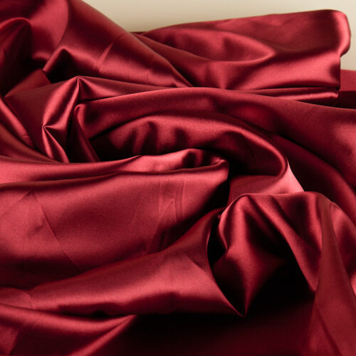 Red color creative material props on a lay-flat angle by Isa Aydin nj ny la