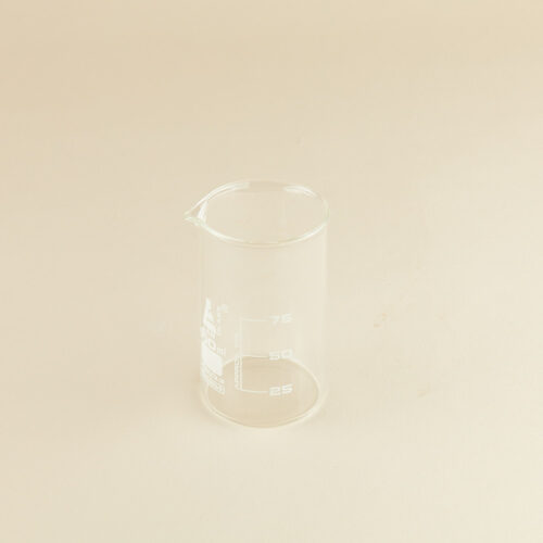 Lab glass baker prop photoshoot on a beige background by Isa Aydin nj ny la