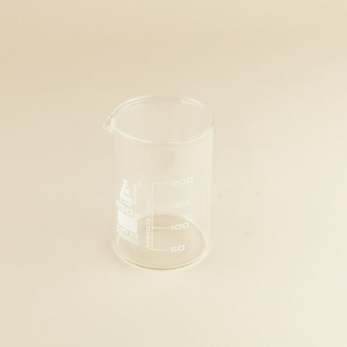 Lab glass baker prop photoshoot on a beige background by Isa Aydin nj ny la