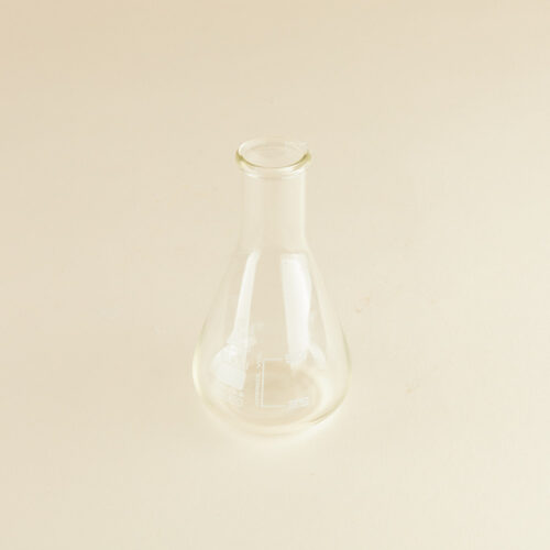 Lab glass baker prop photoshoot on a beige background by Isa Aydin nj ny la