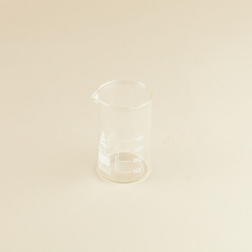 Lab glass baker prop photoshoot on a beige background by Isa Aydin nj ny la