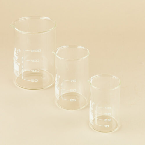 Lab glassware props set on a beige background by Isa Aydin nj ny la