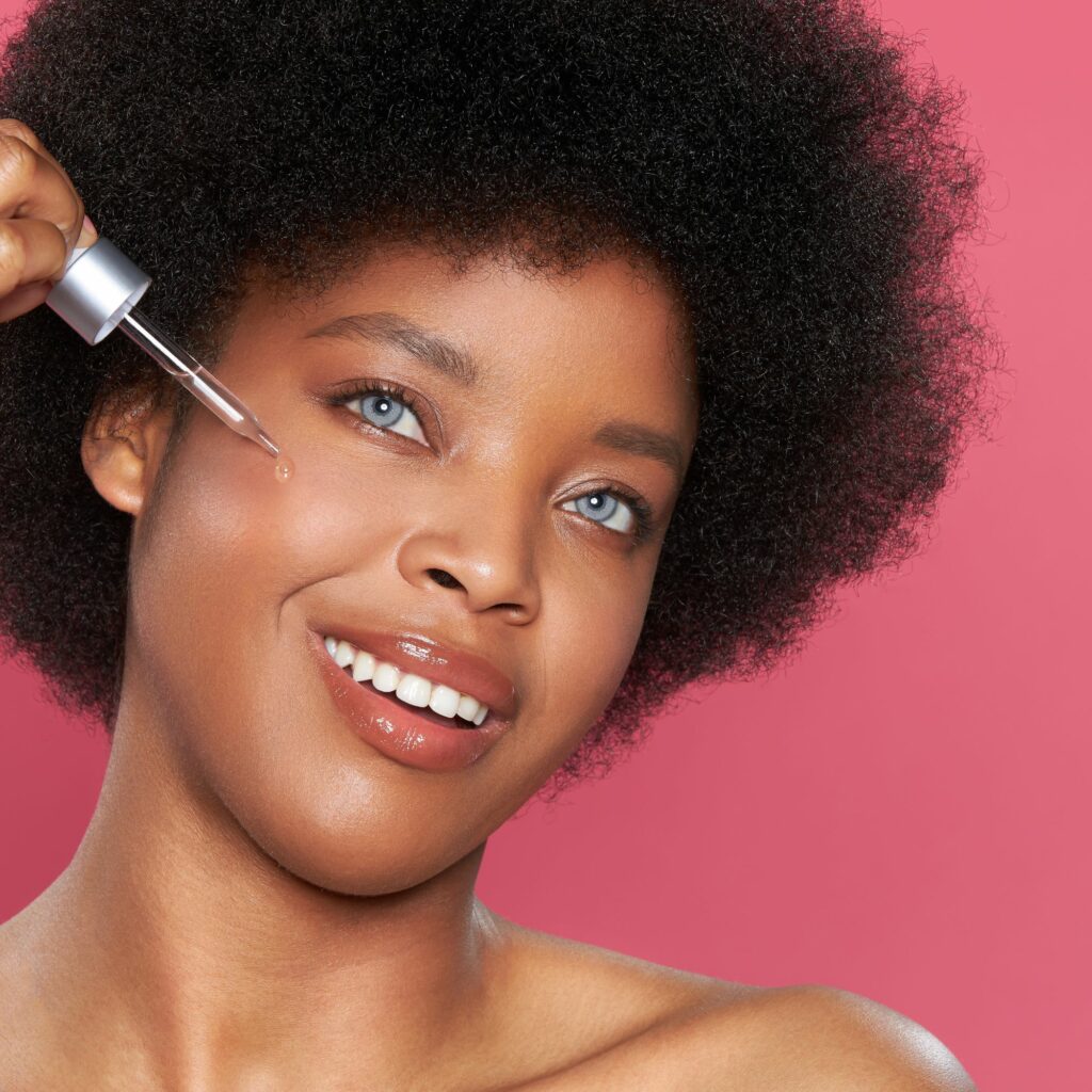 Beauty action shoot with female model on a pink background by Isa Aydin nj ny la