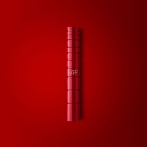 Cosmetics makeup product shoot on a dark red background by Isa Aydin nj ny la