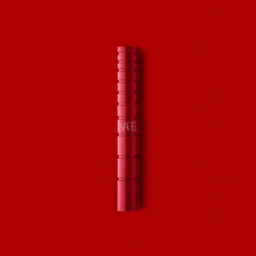 Cosmetics makeup product shoot on a red background by Isa Aydin nj ny la