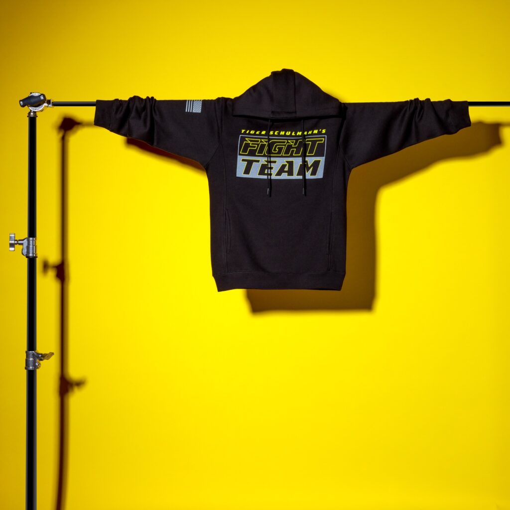 Apperal photoshoot on a hanger and yellow background by Isa Aydin nj ny la