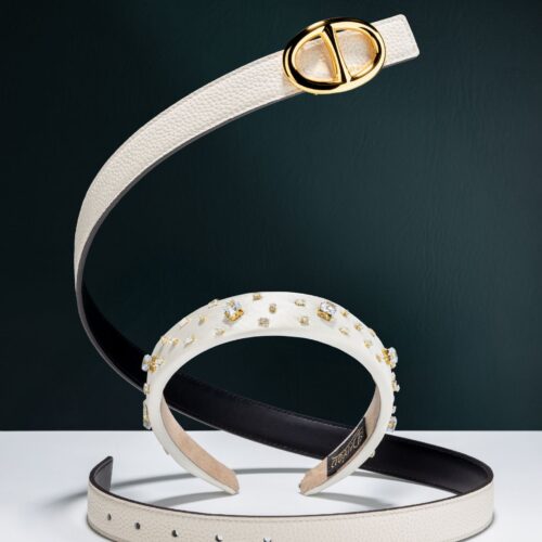 belt creative shot on dark green background witha. headband in the middle product fashion photography